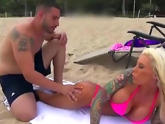 Awesome tow-haired lady with sexy tanned skin, sexy tattoos, big boobs increased by mesmerizing face